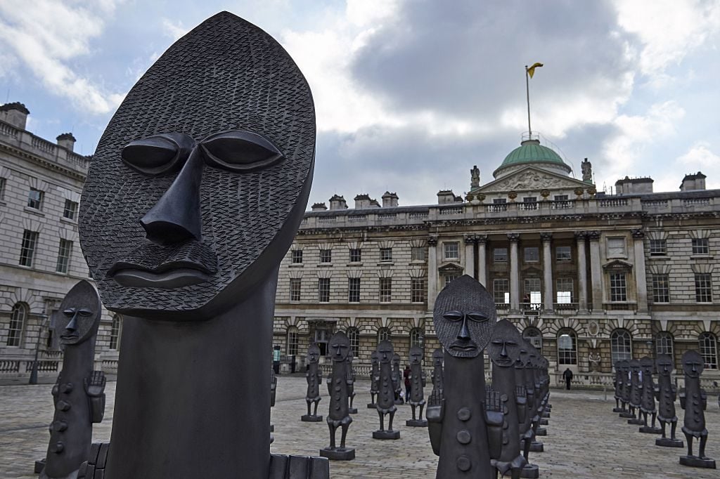 Figures forming an art installation by artist Zak Ove in the courtyard at the Somerset House as part of 1-54 Contemporary African Art Fair in London in 2016. Photo by Niklas Halle'n/AFP/Getty Images.