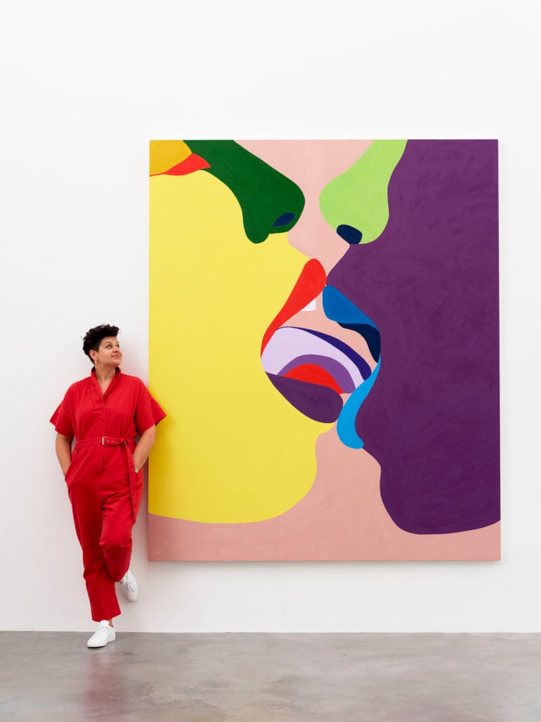 Helen Beard with one of her paintings in the "True Colours" exhibition at Damien Hirst's Newport Street Gallery. Photo courtesy of the Newport Street Gallery.