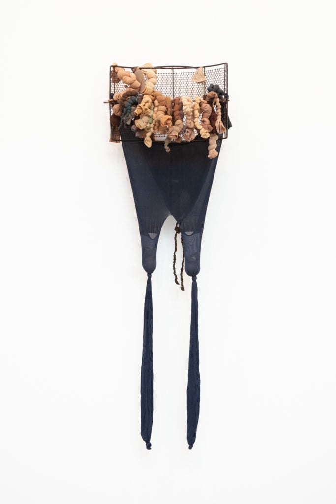 Senga Nengudi. <em>R.S.V.P. Reverie - A</em> (2011). Nylon mesh, sand, found wire object. Photo by Natalie Hon. Courtesy of Lévy Gorvy Gallery, New York and Thomas Erben Gallery, New York.