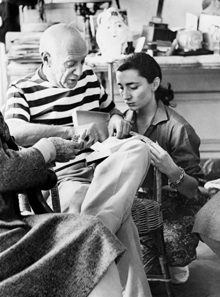 Pablo Picasso and his wife Jacqueline Roque at their home in Vallauris on October 22, 1961. Photo by Andre Villers/AFP/Getty Images.