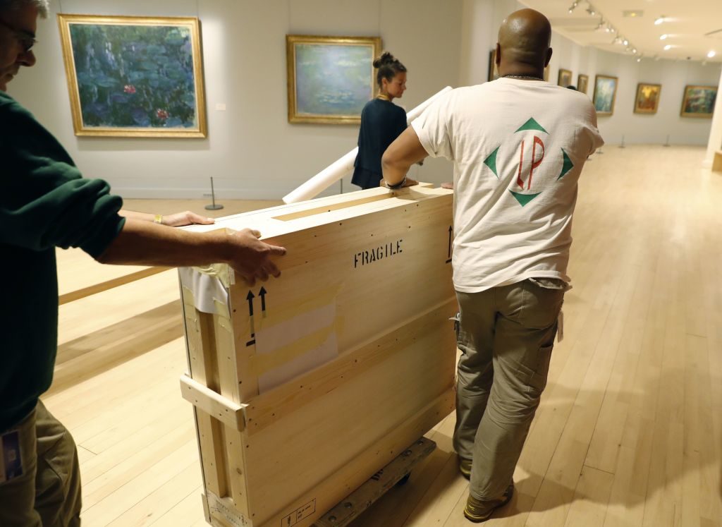 Art being transported in a crate. Photo Patrick Kovarik/AFP/Getty Images.