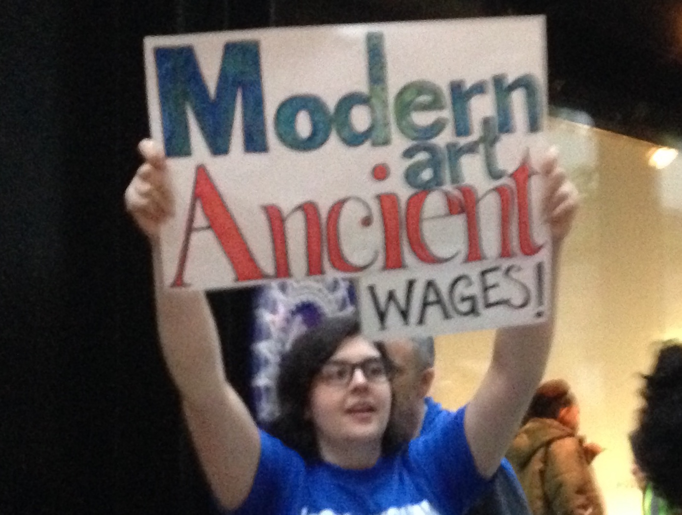 A union member protests outside MoMA's Party in the Garden on May 31, 2018. Photo by Sarah Cascone.