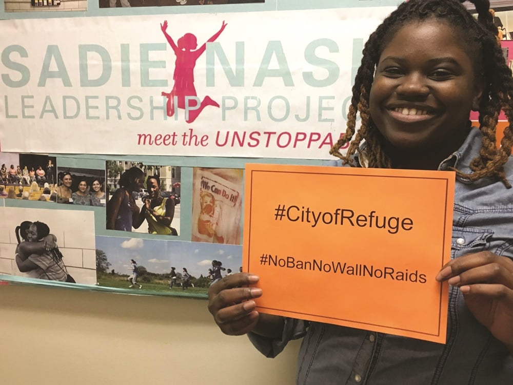 A participant at the Sadie Nash Leadership Project during "City of Refuge" a 24-hour action for refugees effort to stop the refugee ban and preserve temporary protected status.