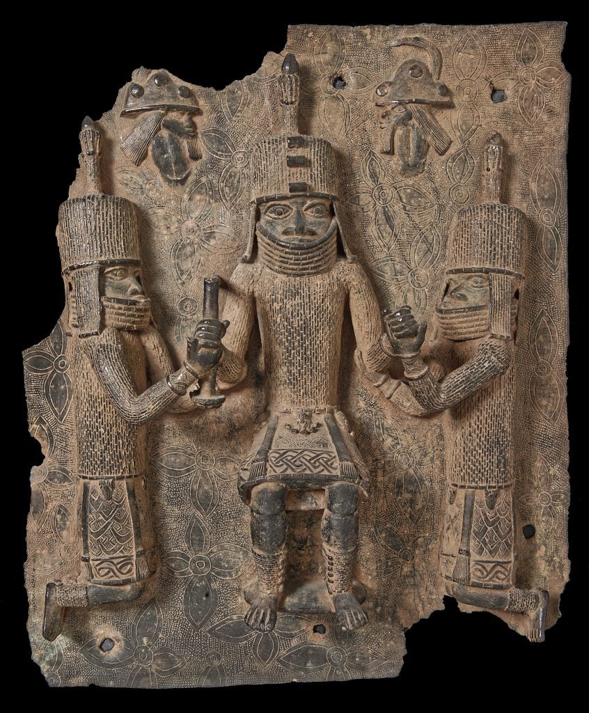 A Bronze Plaque looted from the Royal Palace of Benin, purchased by the Pitt Rivers Museum for five pounds in 1907. Collection of the Pitt Rivers Museum, Oxford.