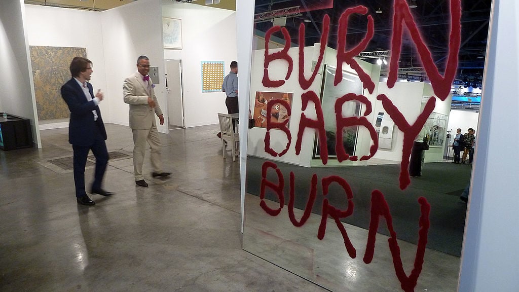The artwork <em>Burn Baby Burn</em>at Paula Cooper Gallery shown at Art Basel Miami Beach, 2010. Photo credit Juan Castro Olivera/AFP/Getty Images.