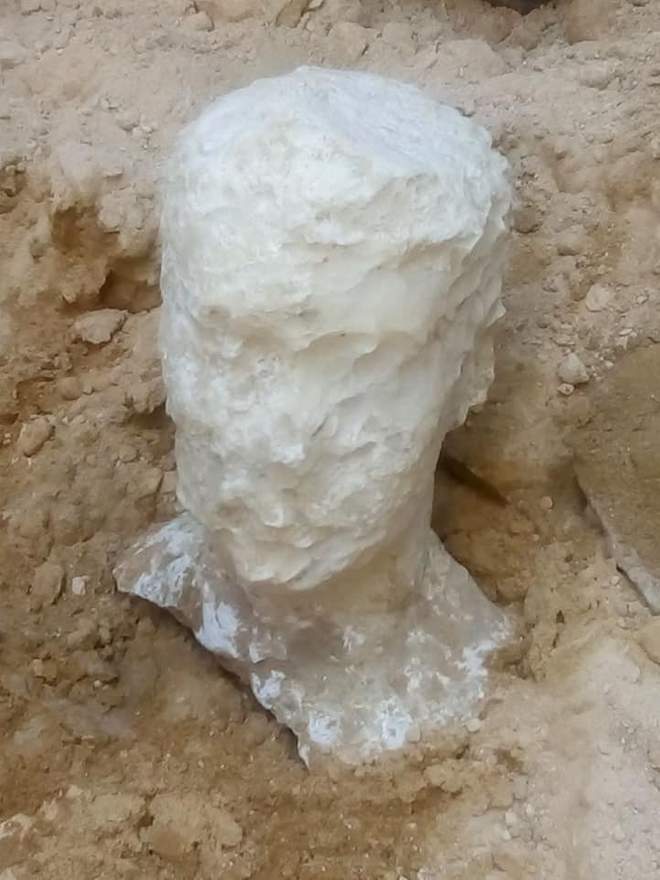 This alabaster head was found alongside a mysterious black granite sarcophagus in Alexandria. Courtesy of the Egyptian Ministry of Antiquities.