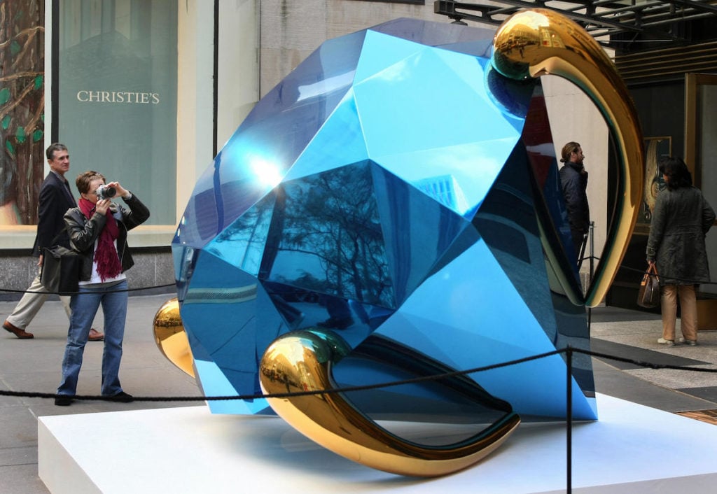Jeff Koons's <em>Diamond (Blue)</em> is displayed and photographed by onlookers in the plaza 13 October 2007 outside Christie's in New York. Photo courtesy Don Emmert/AFP/Getty Images.