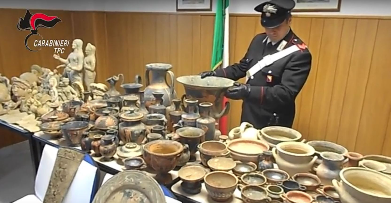 Still of an official taking part in the Carabinieri TPC "Operazione Demetra" via YouTube.