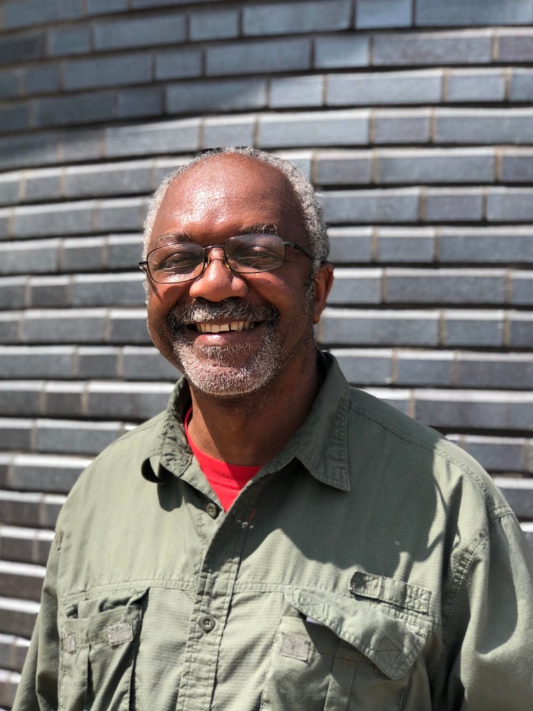 Kerry James Marshall with <em>A Monumental Journey</em>. Photo courtesy of the Greater Des Moines Public Art Foundation.