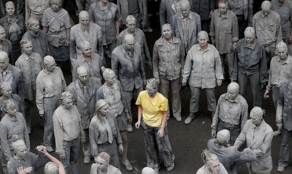 Just what is the relationship between "zombie formalism" and our contemporary economy? Performance artists dressed to look like zombies walk trance-like through the city center on July 5, 2017 in Hamburg, Germany. as part of a protest around the upcoming G20 summit. Photo courtesy Sean Gallup/Getty Images.