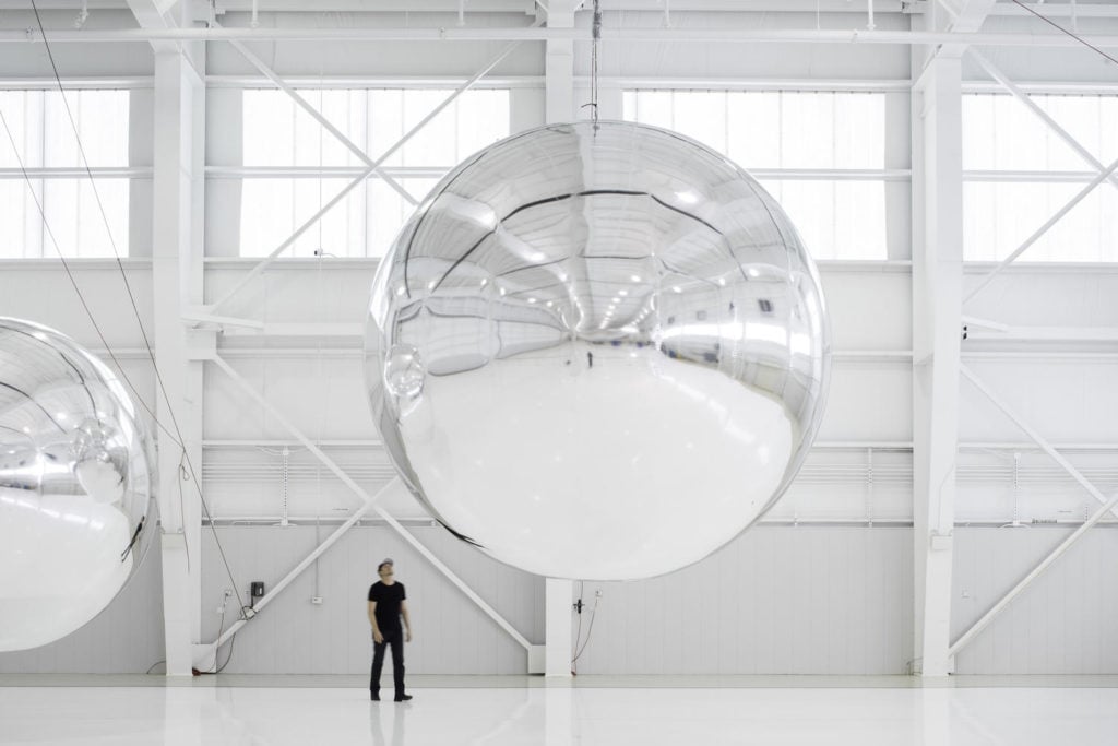 Trevor Paglen with an early prototype of <em>Orbital Reflector</em>. Photo courtesy of Altman Siegel Gallery and Metro Pictures/Nevada Museum of Art.