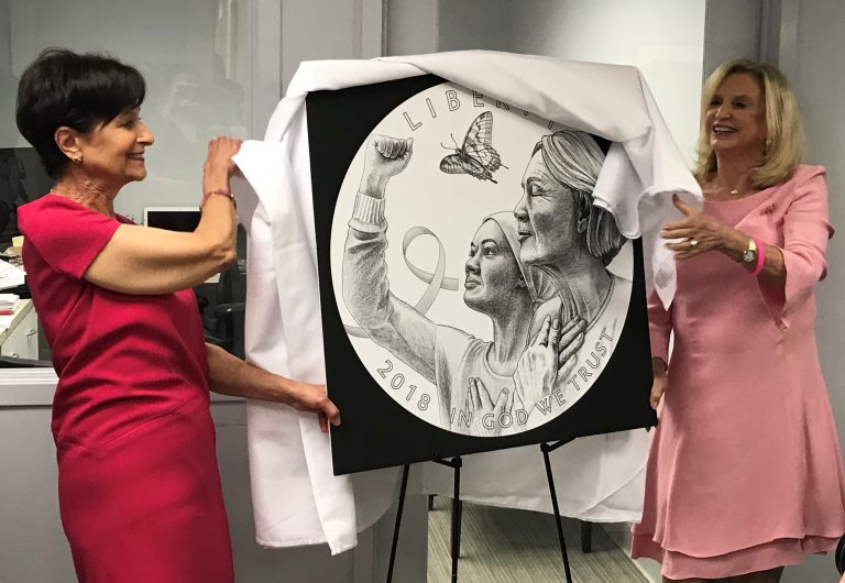 New York Congresswoman Carolyn Maloney and Breast Cancer Research Foundation president and CEO Myra Biblowit unveiling the winning design by Emily Damstra for the Breast Cancer Awareness Commemorative Coin Design Competition. Photo courtesy of the US Mint.