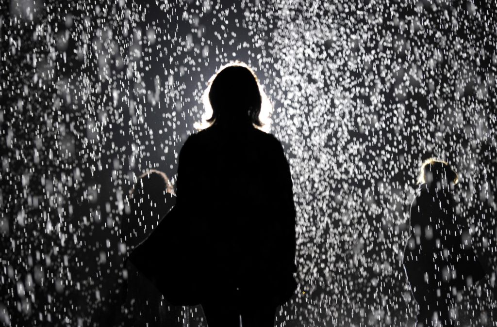 MoMA PS1 presented Random International's <i>Rain Room</i> in 2013 as a major component of "EXPO 1: New York," curated by Klaus Biesenbach. (TIMOTHY CLARY/AFP/Getty Images)