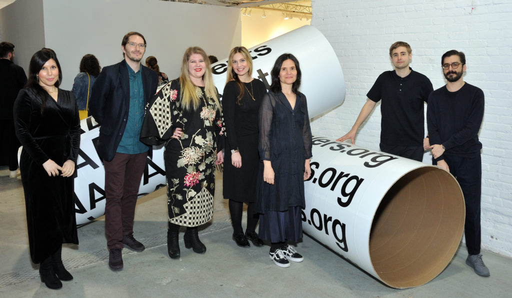 L-R: NADA staff team: Bekka Payack, Max Warsh, Charlotte Walters, Emily Counihan, Heather Hubbs, Thomas Ahlgren and Zack Tornaben attend the New Art Dealers Alliance 2018 Fair at Skylight Clarkson Square in New York. Photo by Stephen Smith/Art Zealous. Photo courtesy of NADA.