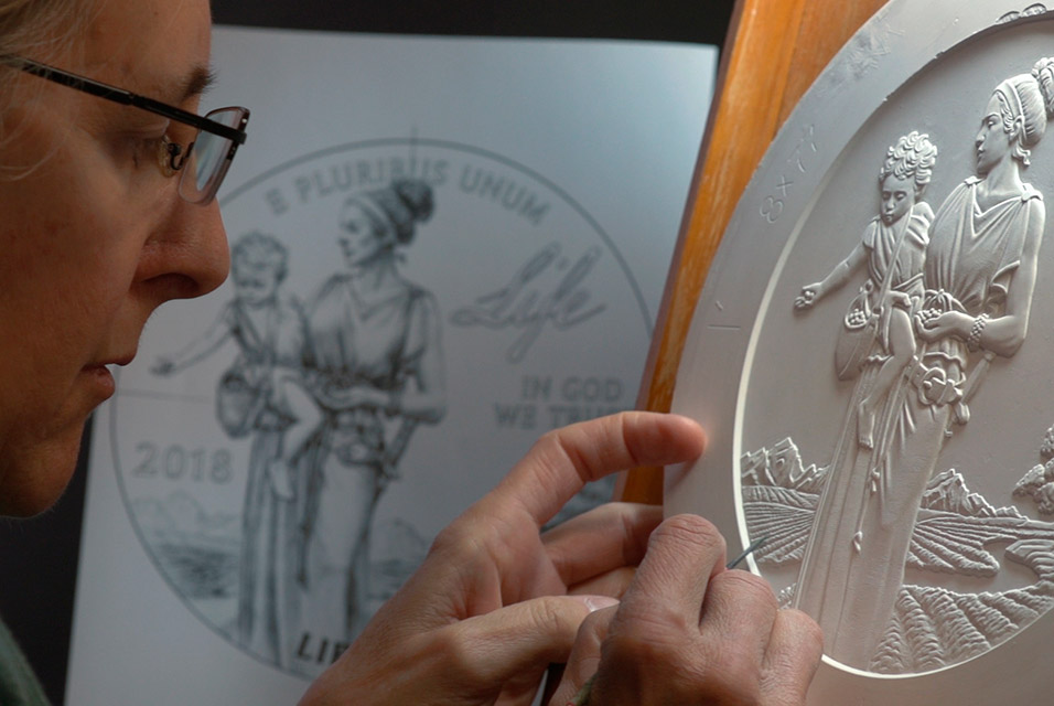 United States Mint sculptor-engraver Phebe Hemphill finalizes design details on a plaster sculpt. Photo courtesy of the US Mint.