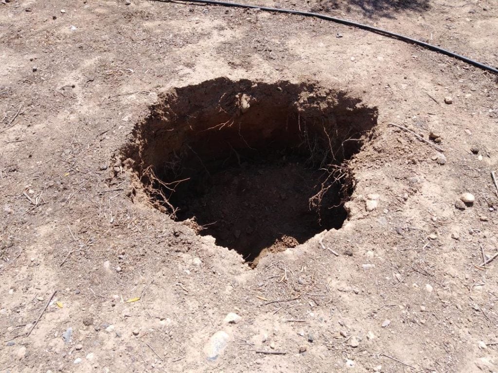 A ancient Minoan tomb was discovered in this hole in Crete. Courtesy of the Greek Ministry of Culture.