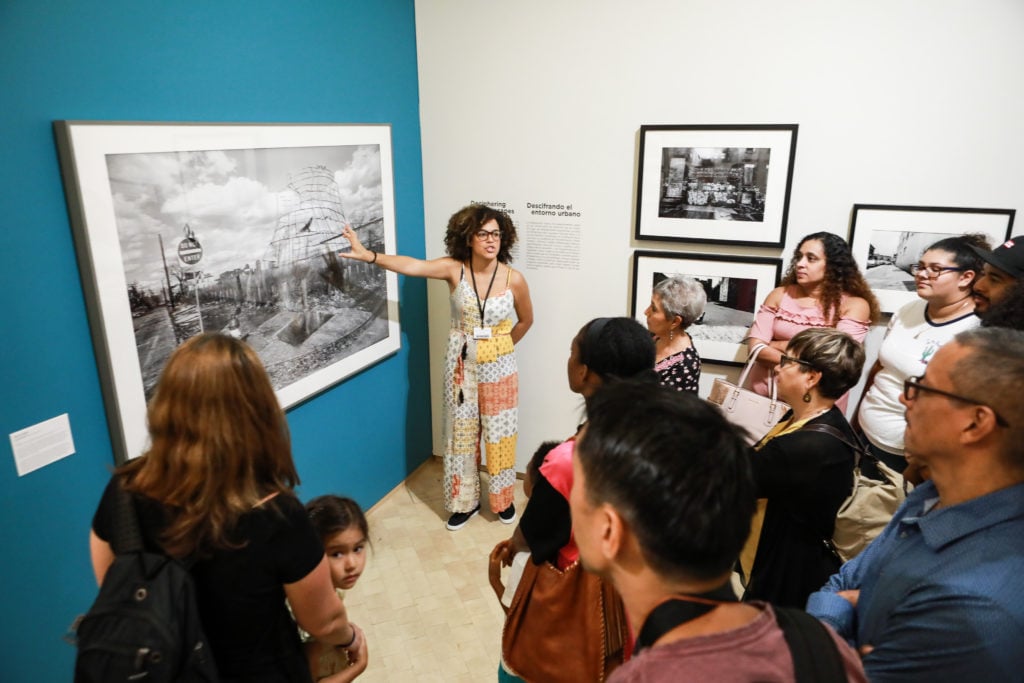 Guests visit the new exhibition "Down These Mean Streets" at El Museo del Barrio, reopened following a 10 month-long renovation. Photo courtesy of El Museo del Barrio.