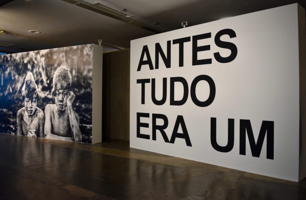 Installation view of the opening of Sofia Borges’s show in “Affective Affinities,” with Martín Gusinde, <em>Arturón and Antonio</em> (1923) at left. Image courtesy Ben Davis.