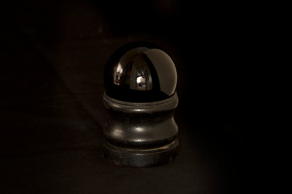 Black Moon crystal ball, (circa 20th century). "Smelly Nelly," a witch who wore copious amounts of perfume in order to commune with the spirits, owned this moon crystal. Photo ©Museum of Witchcraft, Boscastle.