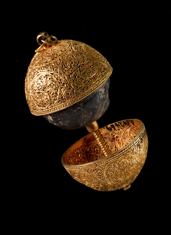 Gold filigree case containing a bezoar, a stone that amasses in the stomachs of ruminants from undigested fiber, used as a remedy for poison. Photo courtesy of the Wellcome Collection, which is cared for by the Science Museum, London; ©Board of the Trustees of the Science Museum, London.