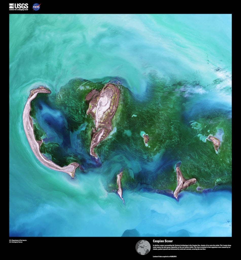 Landsat 8, Caspian Scour. In shallow waters surrounding the Tyuleniy Archipelago in the Caspian Sea, chunks of ice were the artists. The 3-meter-deep water makes the dark green vegetation on the sea bottom visible. The lines scratched in that vegetation were caused by ice chunks, pushed upward and downward by wind and currents, scouring the sea floor. Image courtesy of US Geological Survey/NASA.