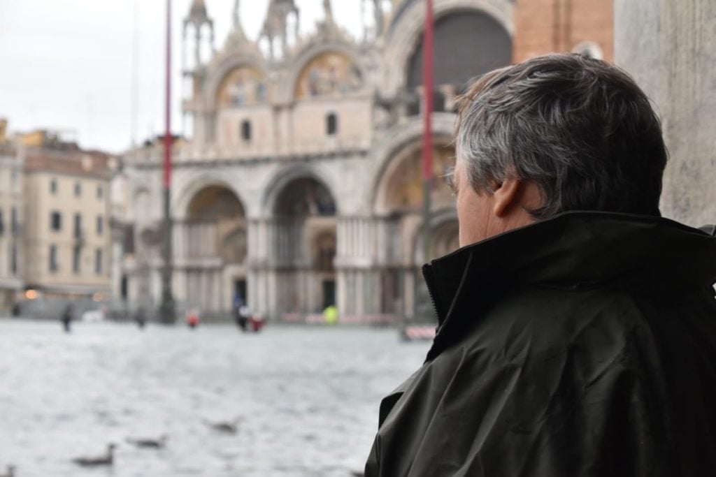 Venice's mayor, Luigi Brugnaro, looks out at flooded Piazza San Marco in this photo posted on Twitter by the city of Venice. Photo courtesy of Comune Venezia.