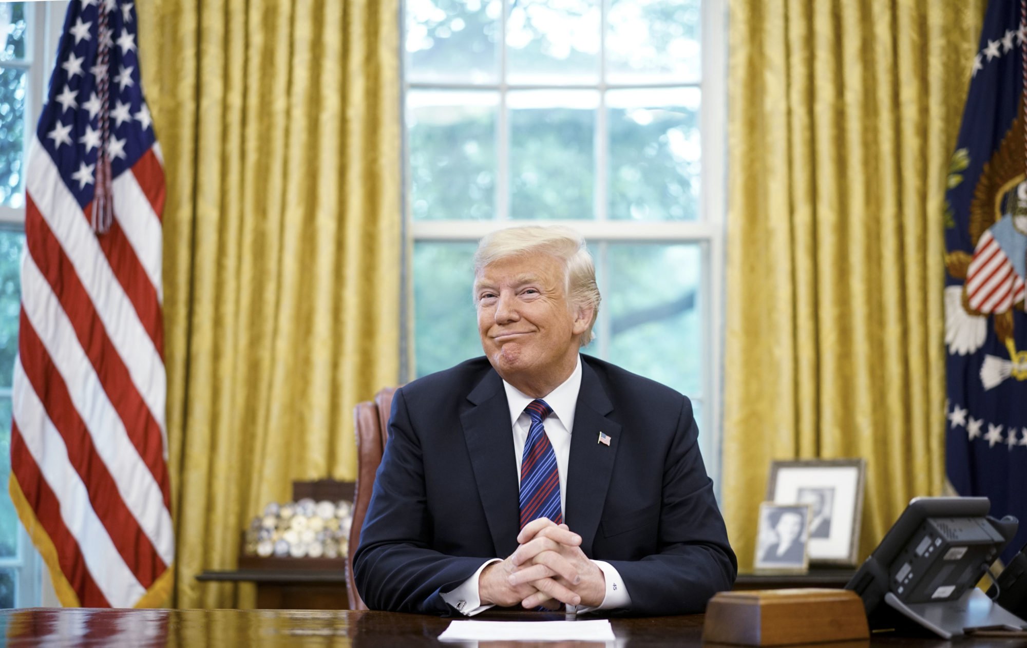 US President Donald Trump smiles. Photo courtesy of Mandel Ngan/AFP/Getty Images