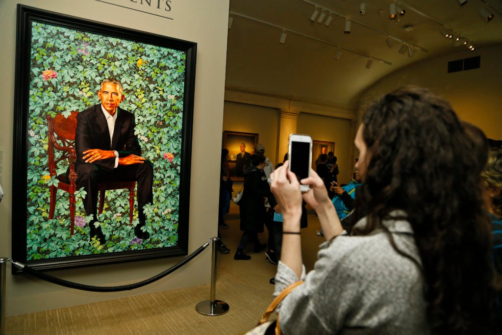 Visitor in America’s Presidents gallery at the Smithsonian’s National Portrait Gallery. Photo by Paul Morigi/courtesy of the Smithsonian’s National Portrait Gallery.