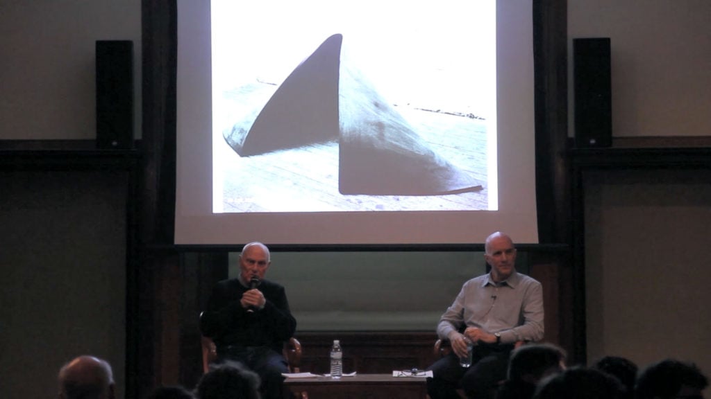 Richard Serra and Hal Foster at “Early Work: Richard Serra, Hal Foster,” an Art Book Series Event at New York Public Library, April 30, 2014. Projected image: Serra’s To Lift (1967). Courtesy the artist and David Zwirner.