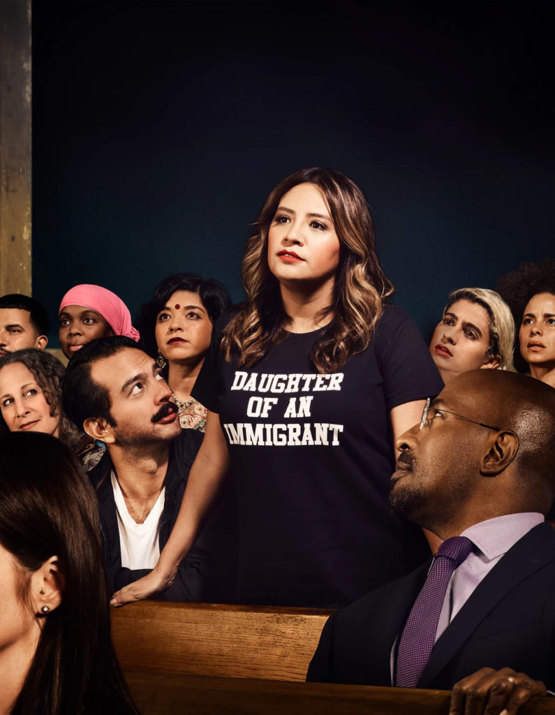 For Freedom's interpretation of Norman Rockwell’s Freedom of Speech, featuring comedian, actor, writer, and producer Cristela Alonzo (standing). Photo courtesy of For Freedoms.
