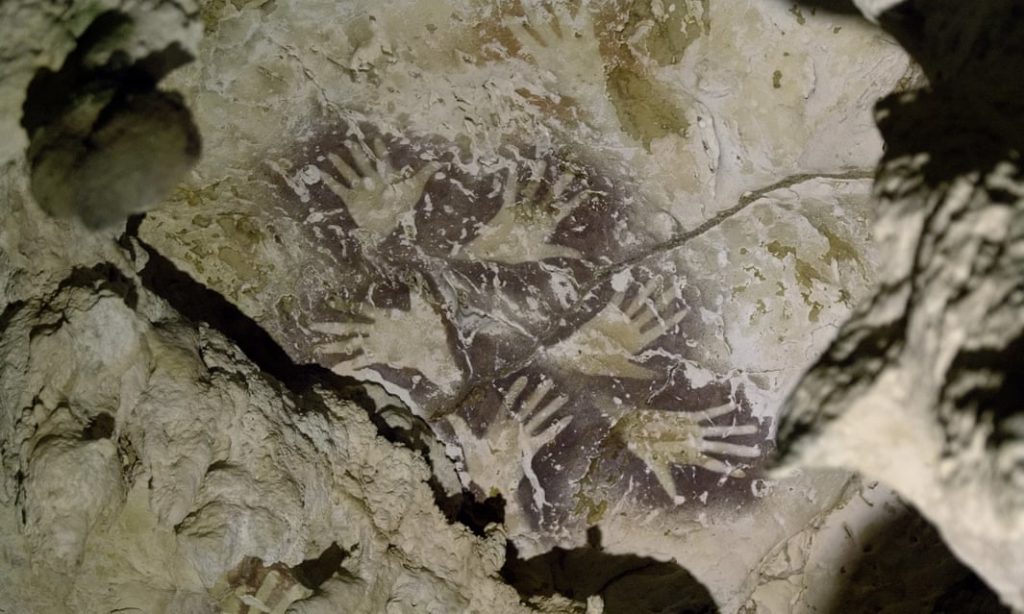 Hand stencils found in the Borneo cave now believed to be home to the world's oldest figurative art. Photo by Kinez Riz.