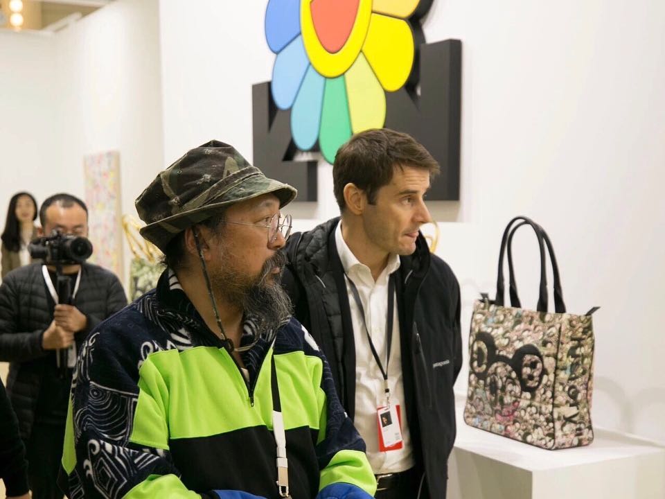 Takashi Murakami visiting booths at Art021 in Shanghai. Photo courtesy of Art021 via Instagram.