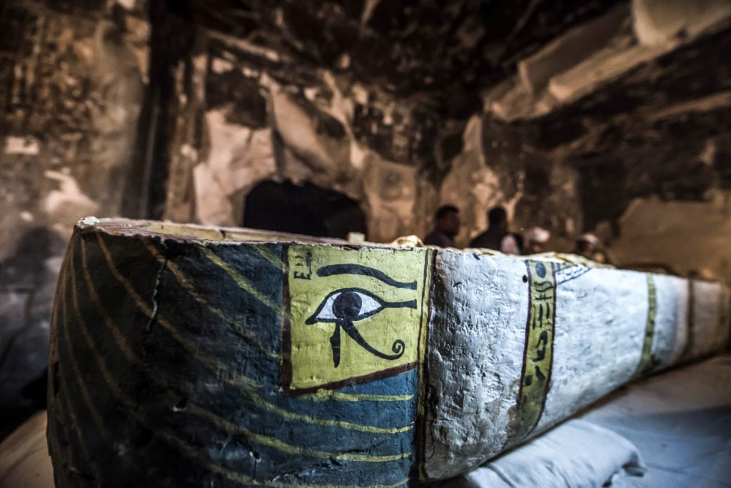 This intact Egyptian sarcophagus containing a well-preserved mummy of a woman named "Thuya" wrapped in linen, was discovered by a French mission at the site of Tomb TT33 which dates to the 18th dynasty. Egypt's Ministry of Antiquities opened the sarcophagus from tomb TT33 at the Al-Assasif necropolis in front of press on November 24, 2018. Photo by Khaled Desouki/AFP/Getty Images.