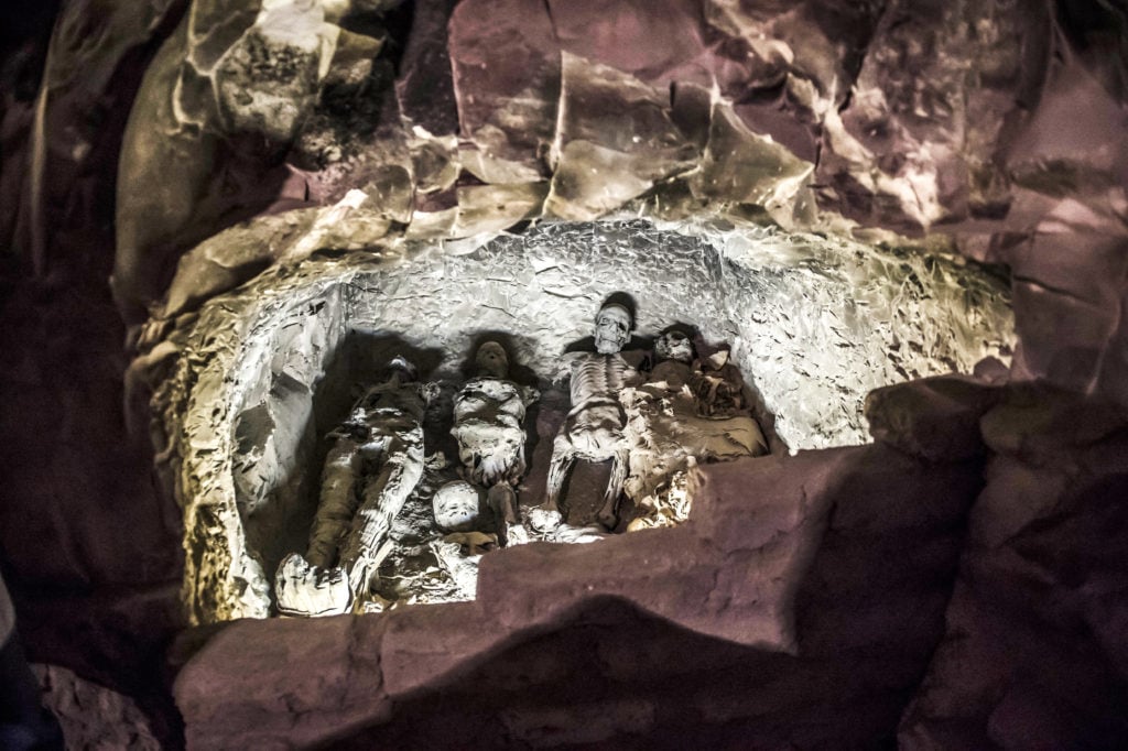 A group of mummies stacked together at the site of tomb TT28, or Thaw-Irkhet-If, which was discovered by an Egyptian archaeological mission at Al-Assasif necropolis on the west bank of the Nile north of the southern Egyptian city of Luxor. Photo by Khaled Desouki/AFP/Getty Images.