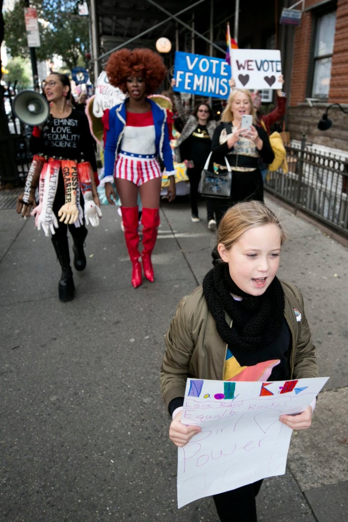 Michele Pred's daughter Linnea leading her mother's We Vote Parade. Photo by Pontus Hook.