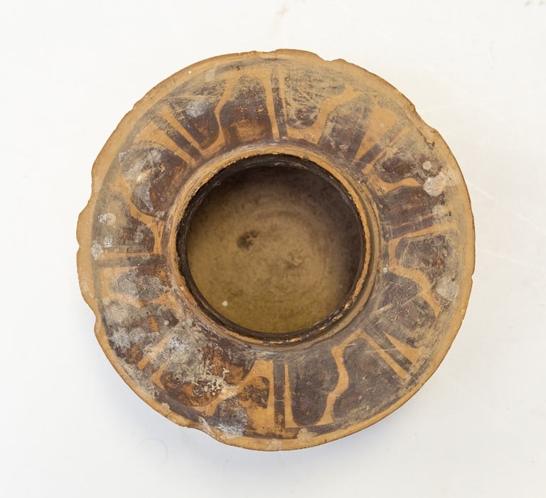 An unsuspecting auction house employee was using this 4,000-year-old pot as a toothbrush holder until he spotted some similarly looking antiquities at work and had the piece examine by an expert. Photo courtesy of Hansons Auctioneers.