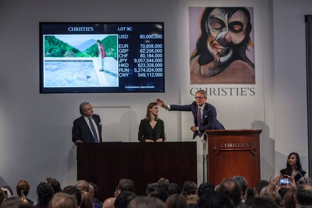 Bidding for David Hockney, <em> Portrait of an Artist (Pool with Two Figures) </em>, 1972, at Christie's post-war and contemporary evening sale in November 2018. Courtesy of Christie's Images Ltd.