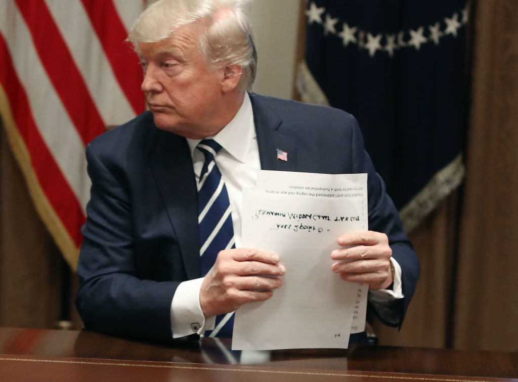 U.S. President Donald Trump holds his notes as he talks about his meeting with Russian President Vladimir Putin, on July 17, 2018. Photo by Mark Wilson/Getty Images.