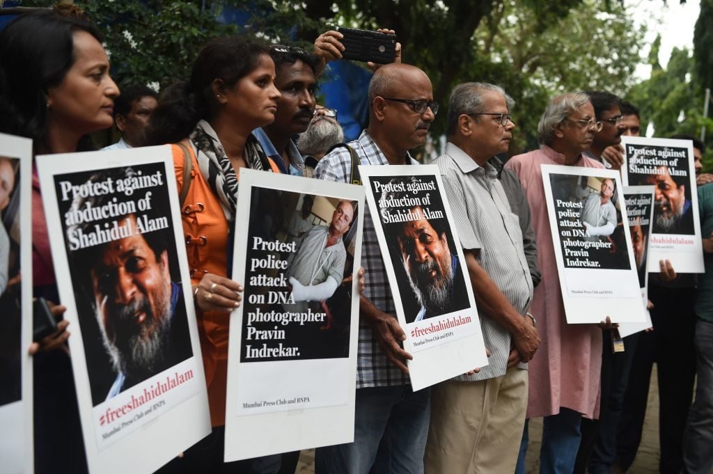 Indian photographers and journalists gather outside the Mumbai press club to protest against the arrest of activist and photographer Shahidul Alam in Dhaka, in Mumbai on August 7, 2018. Photo courtesy Punit Paranjpe/AFP/Getty Images.