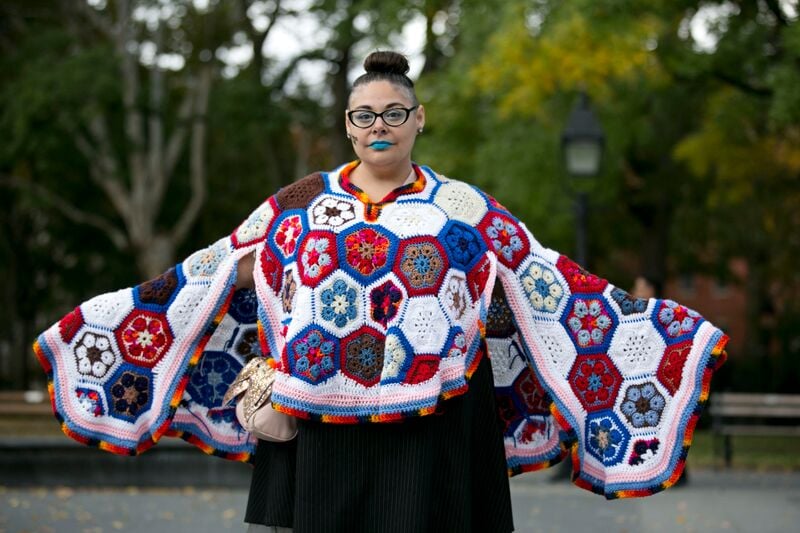 Daniela Puliti wearing her crocheted <em>Art, Empathy, Community, Voice, Choice & Vote</em> cape at Michele Pred's We Vote Parade. Photo by Pontus Hook.