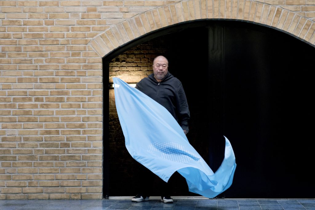 Ai Weiwei at his Berlin studio with his flag to mark the 70th anniversary of the Declaration of Human Rights. Photo by Camilla Greenwell.