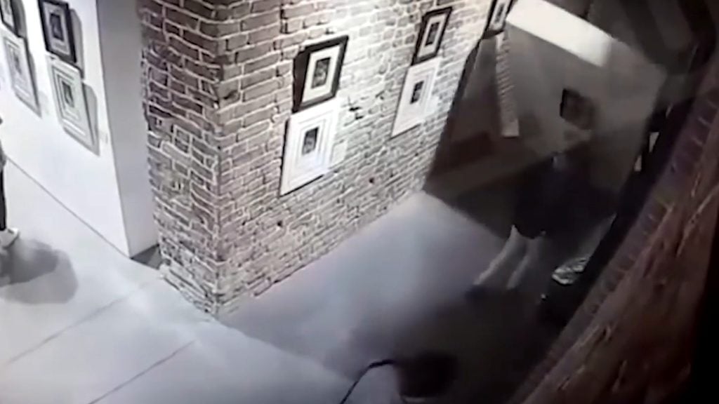 Security footage at the Main Avenue Cultural Center in Yekaterinburg, Russia, shows a wall of artwork collapsing.
