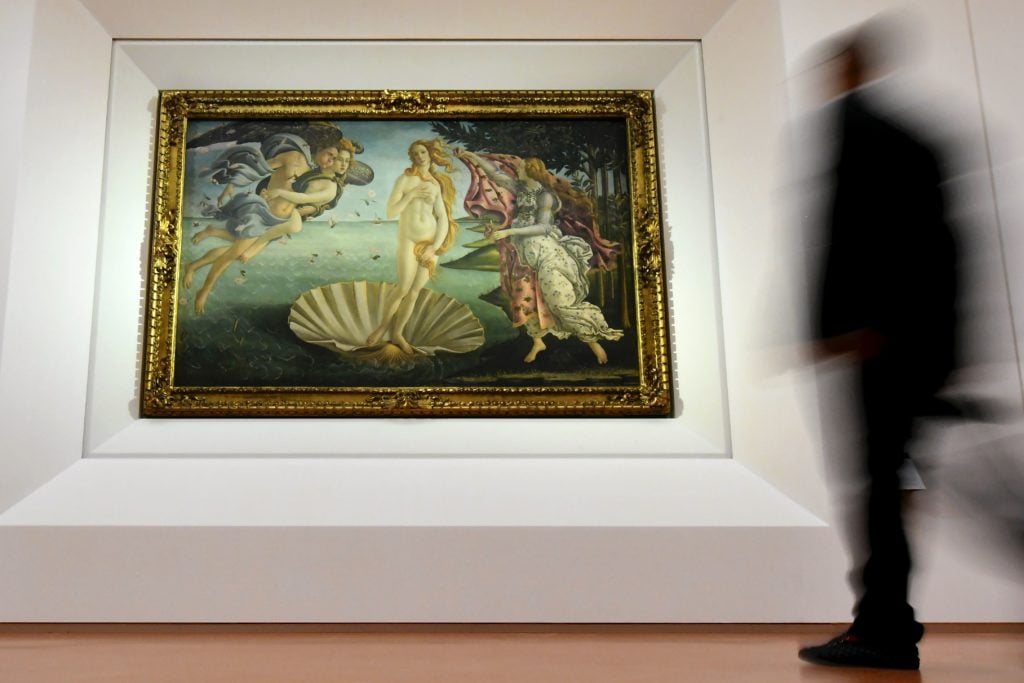 Sandro Botticelli, <i>The Birth of Venus</i> (1485) at the Uffizi Gallery in Florence. Photo by Alberto Pizzoli/AFP/Getty Images.