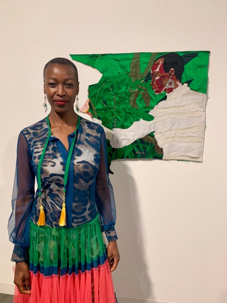 Billie Zangewa with her work at Blank Projects at Art Basel Miami Beach. Photo by Sarah Cascone. 