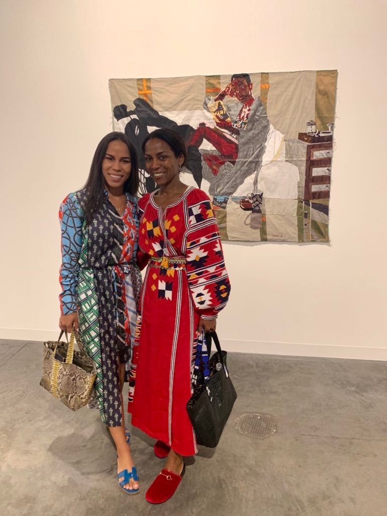 Michelle Helmer and Shevanne Helmer with work by Billie Zangewa at Blank Projects at Art Basel Miami Beach. Photo by Sarah Cascone. Photo by Sarah Cascone. 