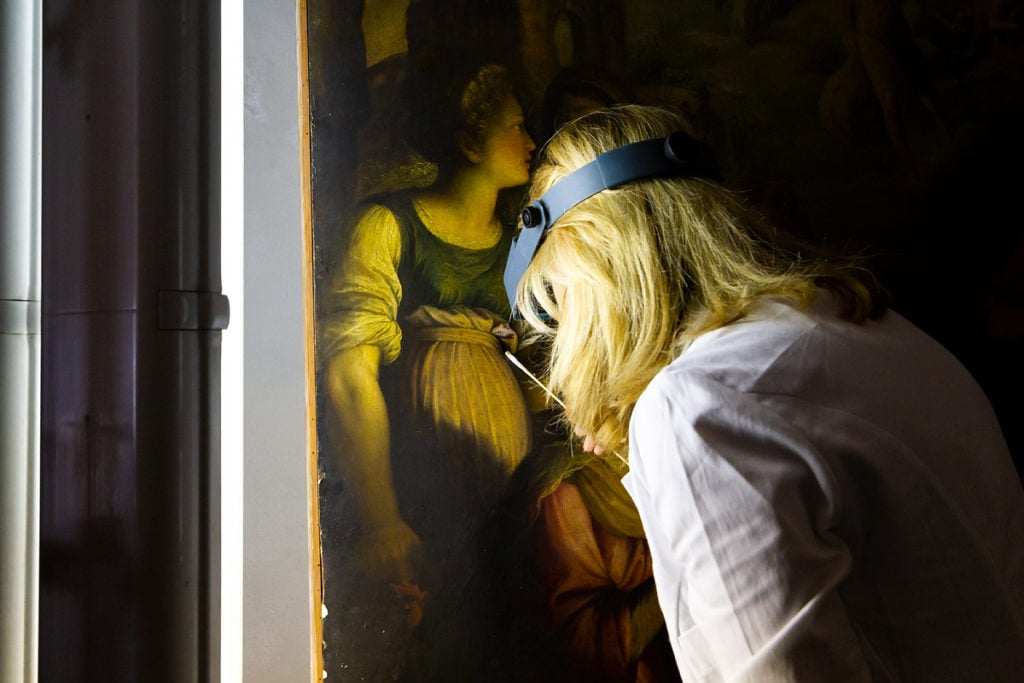 Valeria Merlini doing a cleaning sample of Fabrizio Santafede's 16th century oil on panel. Photo courtesy of Studio Merlini Storti. 