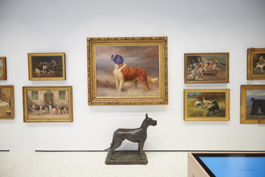 Paintings on view, including Maud Earl's I Hear a Voice at center, at the American Kennel Club's Museum of the Dog. Photo by David Woo.