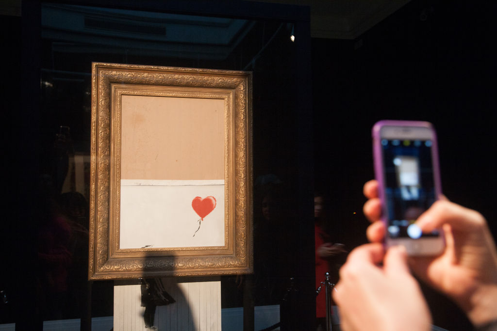 Banksy's Love is in the bin. Photo by Amer Ghazzal / Barcroft Media via Getty Images.