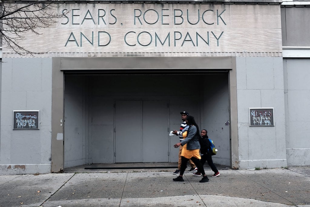 People walk by a Sears store in Brooklyn on October 15, 2018 in New York City, after the colossal American retailer filed for Chapter 11 bankruptcy protection. Photo by Spencer Platt/Getty Images.