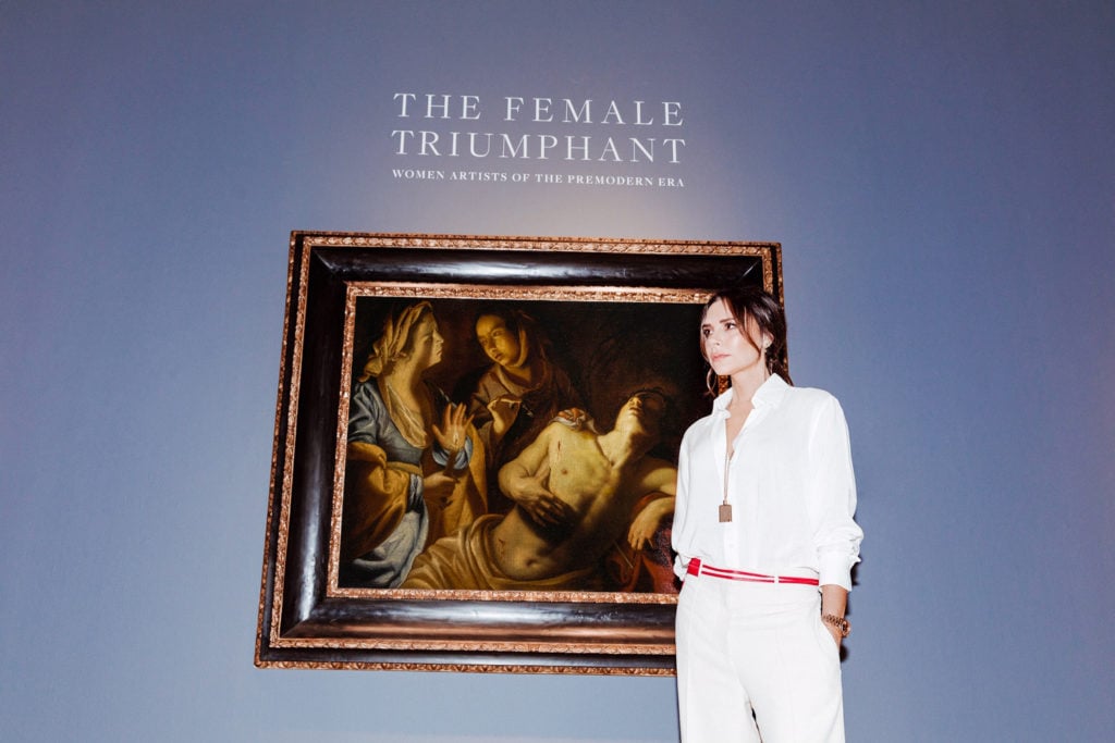 Victoria Beckham with Artemisia Gentileschi's Saint Sebastian Tended By Irene at the exhibition for "The Female Triumphant" at Sotheby's New York. Photo courtesy of Tom Newton.